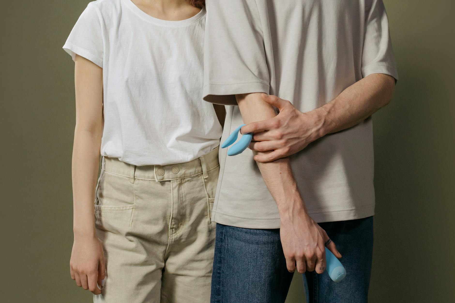 A young couple standing together indoors, exploring modern intimacy and connection